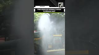 PWD vehicles sprinkle water in Delhi to reduce dust amid rise in air pollution [upl. by Lacram]