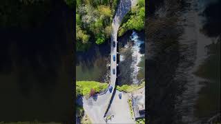 Stunning Stone Arch Bridge over River 🏞️🌉 shorts drone dji waterfall beautiful djimini2 [upl. by Winzler]