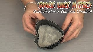 How To Line A Heart Shaped Baking Pan With Parchment Paper [upl. by Lashondra]