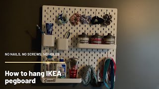 How to hang an IKEA pegboard without screws using Command Strips [upl. by Dobrinsky]