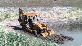 Backhoe Stuck In Mud [upl. by Lilias]