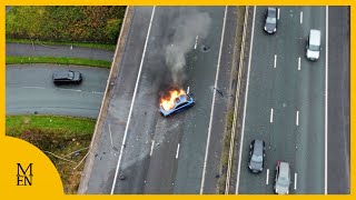 Dramatic drone footage shows moment car becomes engulfed by flames on M61 [upl. by Jehovah821]