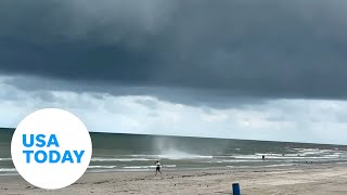 Waterspout forms in Galveston while Texas beachgoers enjoyed waters  USA TODAY Shorts [upl. by Kirschner]