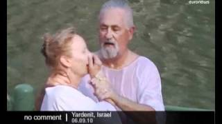 Christian pilgrims baptised in Israel [upl. by Dougherty]