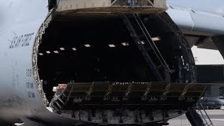 ENORMOUS AIRPLANE Blackhawk helicopters are unloaded from a C5M SUPER GALAXY AIRCRAFT [upl. by Retep]