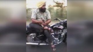 Indian Man Casually Rides Side Saddle on a Motorcycle [upl. by Namyw]