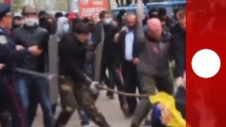 Ukraine violence ProRussian militants clash with unity march in Donetsk [upl. by Dorsman]