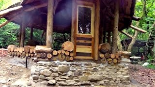 Off grid roundhouse build part 12 cordwood walls lime plaster and flooring [upl. by Hanford818]