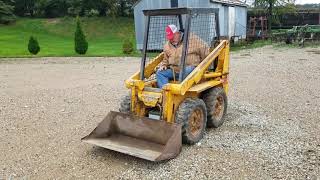 OMC Mustang 320 skid steer [upl. by Chainey119]