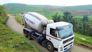 Volvo Ready Mix Cement Truck Working Pouring Concrete On Hill Road Construction [upl. by Kaplan]