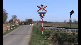 A Danish IC3 train passes railroad crossing nearby Radbjerg [upl. by Gnilyarg]