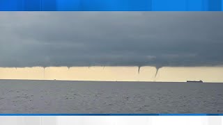 Multiple waterspouts develop from Lake Pontchartrain to offshore [upl. by Anaeli]