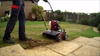 SCARIFYING MOSS AND THATCH OUT OF A SMALL LAWN [upl. by Varuag857]