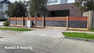 Horizontal merbau and corrugated Colorbond front fence with double sliding gate [upl. by Airogerg]