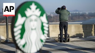 Starbucks opens branch at South Korean observatory near border with North Korea [upl. by Anaizit]