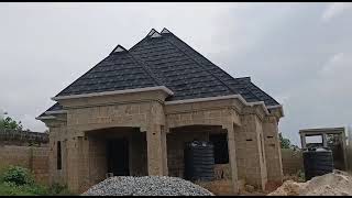 Stone coated steel roofing installation in Nigeria  Black and white shingle design [upl. by Kyrstin846]