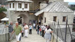 Old bridge  Stari most in Mostar with muezzin [upl. by Atsyrhc]