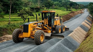 The main technology yellow motor grader machine with the brand SDLG Making pushes layers of gravel [upl. by Hough]