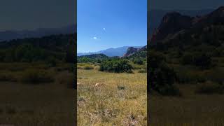 A field with mountains in the background travel nature mountain traveling viralshorts shorts [upl. by Ahseket953]