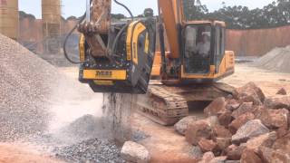 MB crusher bucket crushing blue granite in China [upl. by Aidualk18]