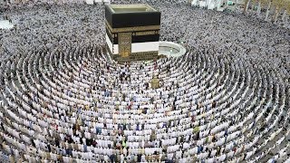 Thousands of Muslim worshippers perform prayers around the Kaaba [upl. by Mide]