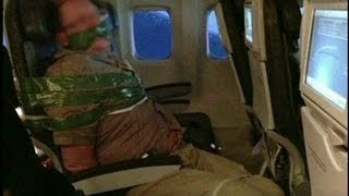 Unruly plane passenger ducttaped to seat [upl. by Swenson]