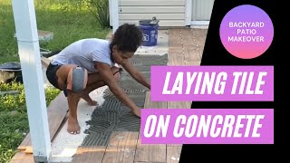 Laying ceramic tile on a concrete patio [upl. by Livingston]