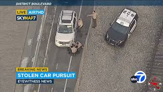 FULL CHASE Carjacking suspect drives over spike strips goes off road onto bike path [upl. by Gaulin486]