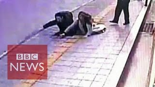 Video Sinkhole in South Korea swallows 2 pedestrians  BBC News [upl. by Noedig]