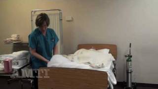 CNA Skills Making an Occupied Bed Making Part 1 [upl. by Ahsilav]