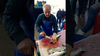 Cleaning farmed trout at a fishmongers with great skill [upl. by Erving263]