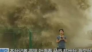 Look behind you Huge wave lands on TV reporter [upl. by Ferdy709]