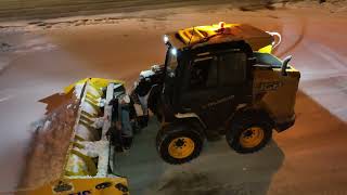 Snow plowing parking lots with skid steer drone clips [upl. by Derzon337]