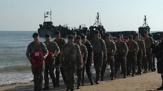 British Marine commandos land on Gold beach for DDay commemorations  AFP [upl. by Aihsyt]