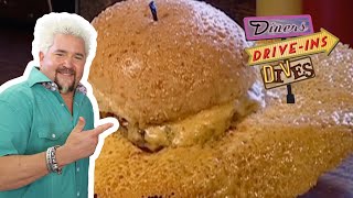 Guy Fieri Eats a Burger with a MASSIVE Cheese Skirt  Diners DriveIns and Dives  Food Network [upl. by Aymahs]