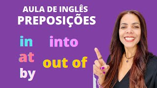 Como usar as preposições de lugar e movimento IN at BY INTO e OUT OF  Aula de inglês [upl. by Peednus]