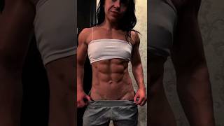 Female bodybuilder flexing shredded abs [upl. by Ahsahtan]