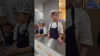 Cookie Experts are working in Famous Amoss Cookie Factory KidZania KL kidzania kidzaniakl [upl. by Sucy]