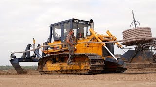 Laying field drainage  Komatsu D65P Vplow Bulldozer  Gebr Emonds drainage system [upl. by Irtimd652]