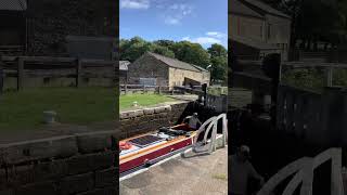 Di amigo and another narrowboat at the locks near Gargrave on the Leeds and Liverpool canal canals [upl. by Yelsek459]