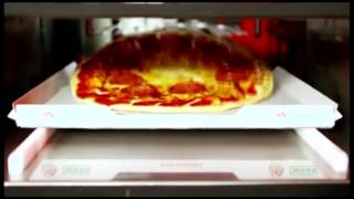 Así es una máquina expendedora de pizzas [upl. by Yllime]