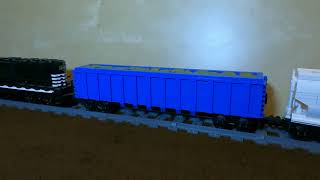 LEGO  Rebrickable promo video  US trash gondola  64ft grain hopper car pulled by a NS EMD GP402 [upl. by Arikaahs]