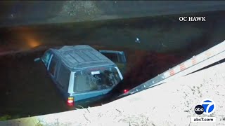 Driver rescued after car lands in Huntington Beach water canal [upl. by Saltzman791]