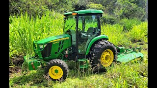 Massive Grass Growth taken care of with the John Deere 4066R [upl. by Riehl]