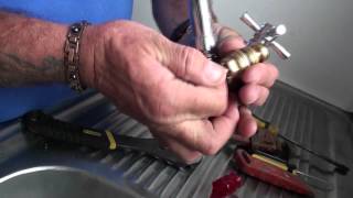 Repairing a dripping tap by washer replacement and regrinding seat [upl. by Acenahs]