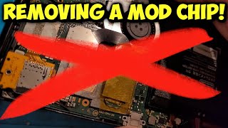 Desoldering a mod chip to go back to stock [upl. by Atteloiv]