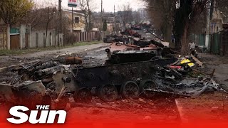 Streets of wartorn Bucha are littered with destroyed Russian tanks [upl. by Aerdnad]