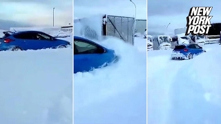 Man uses brandnew Ford Focus to plow through piles of snow [upl. by Asirehc]