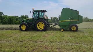 John Deere Tractors Cutting Tedding Raking Baling Hay [upl. by Altis33]