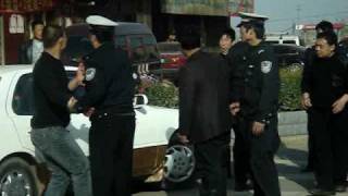 Useless Cop Gets Beat Up in China [upl. by Nwahsel182]